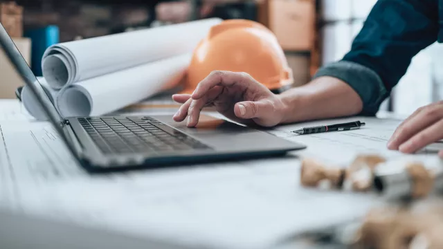 Laptop and hard hat